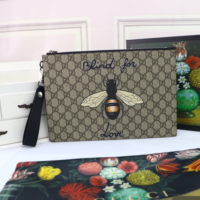 G*u*i clutch bags